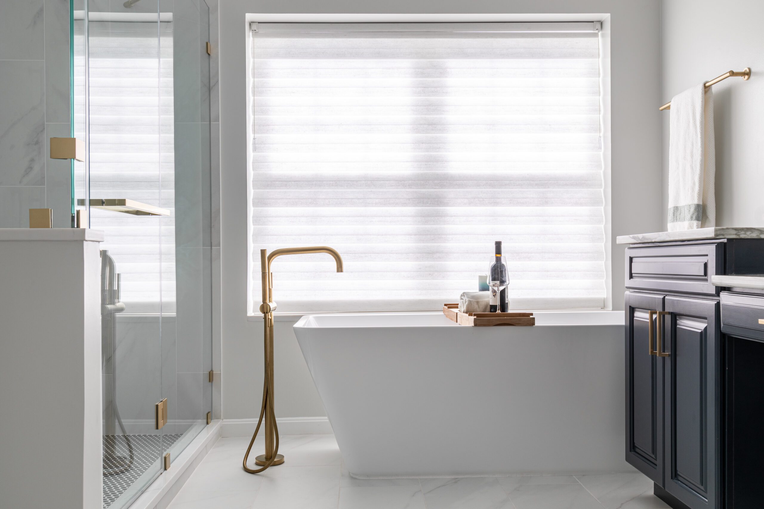 Photo of a bathroom design project where a small bath was transformed into a spacious shower room with a large soaker tub
