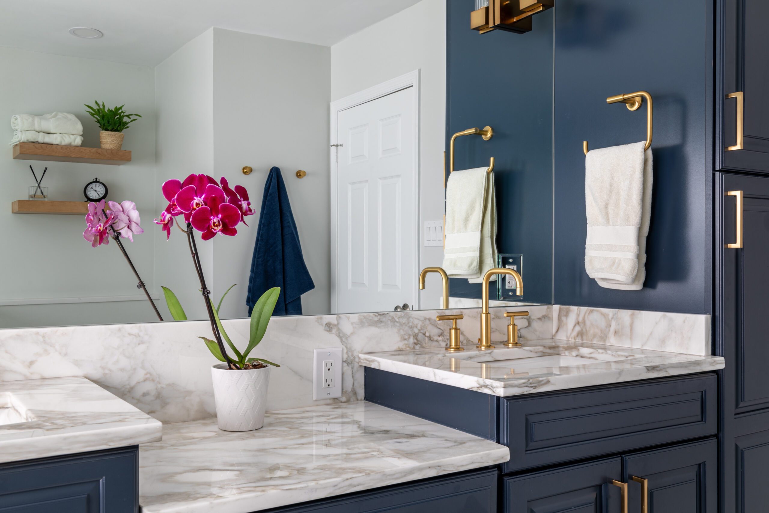 Photo of a bathroom design project featuring ample storage and luxury details