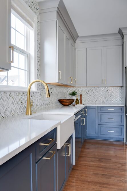 Photo of a kitchen design project in Ashburn VA featuring a soothing gray and blue color palette and quality hardware