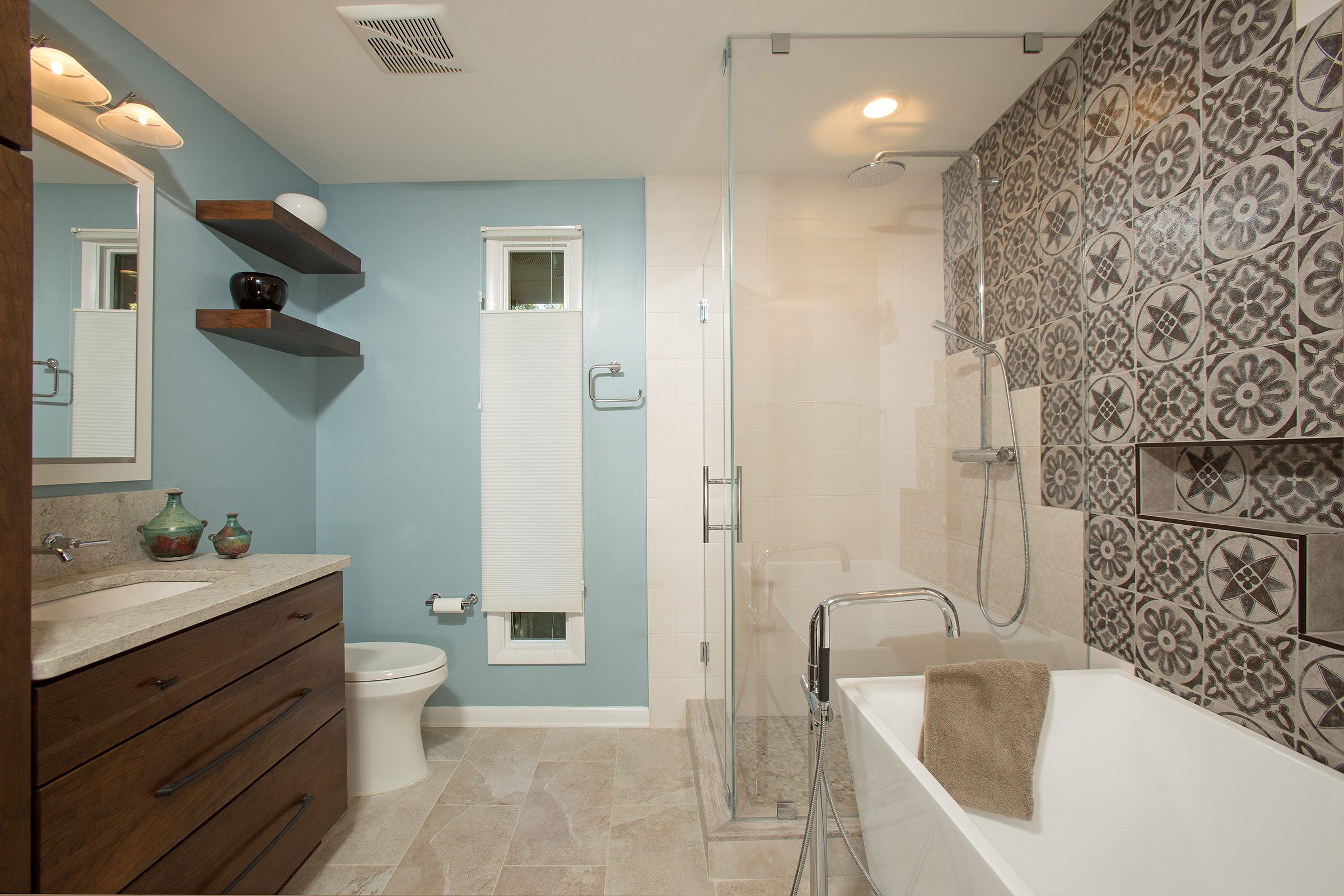 A photo of a European style modern bathroom with custom tile work